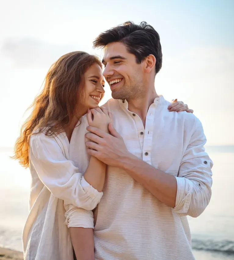Senior couple walking hand in hand on a gravel path